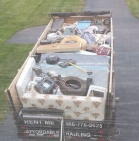 Affordable Hauling trailer filled with junk removal items