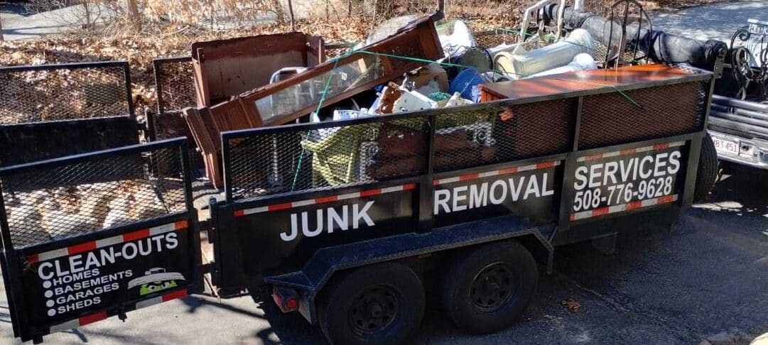An Affordable Hauling trailer loaded with junk removal
