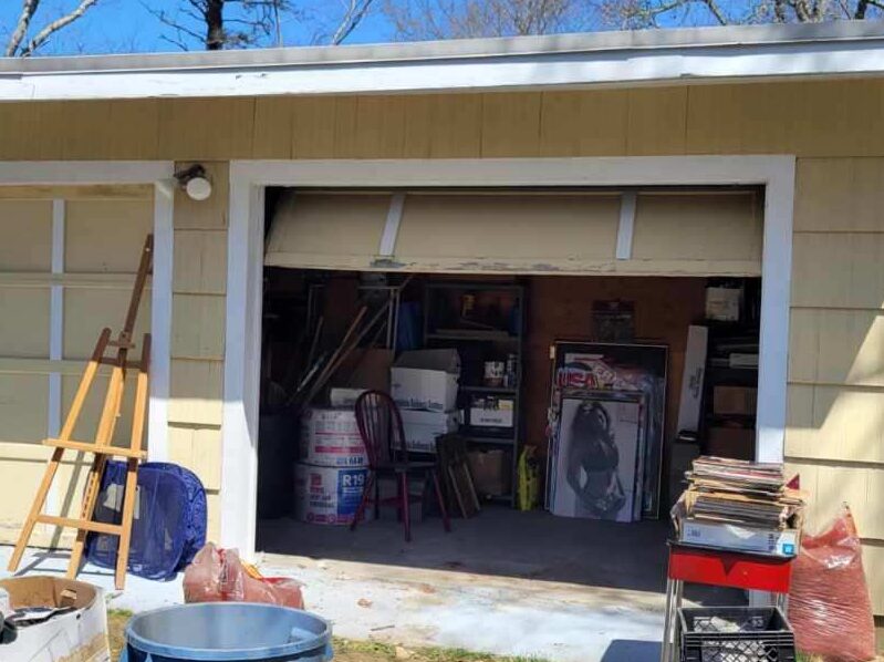 Yellow garage with items to be removed