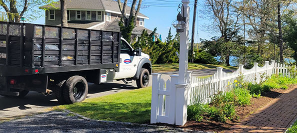 White company truck in front of customer home
